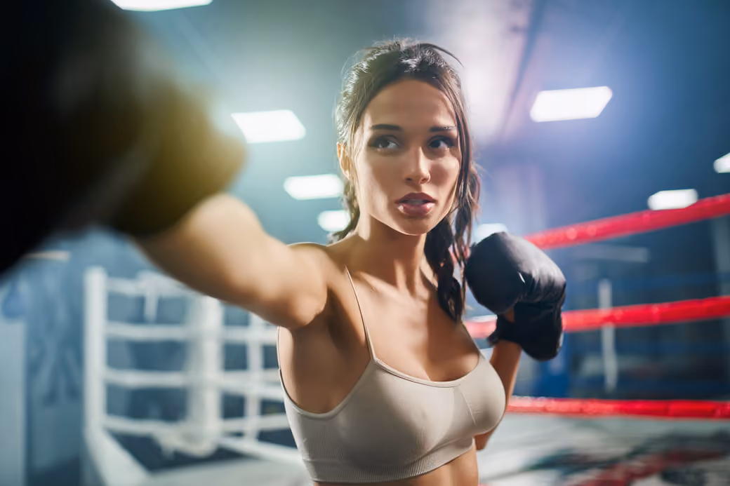 Female boxer training inside boxing ring - Wallpapers for Samsung, HTC, Sony in 540x960 resolution