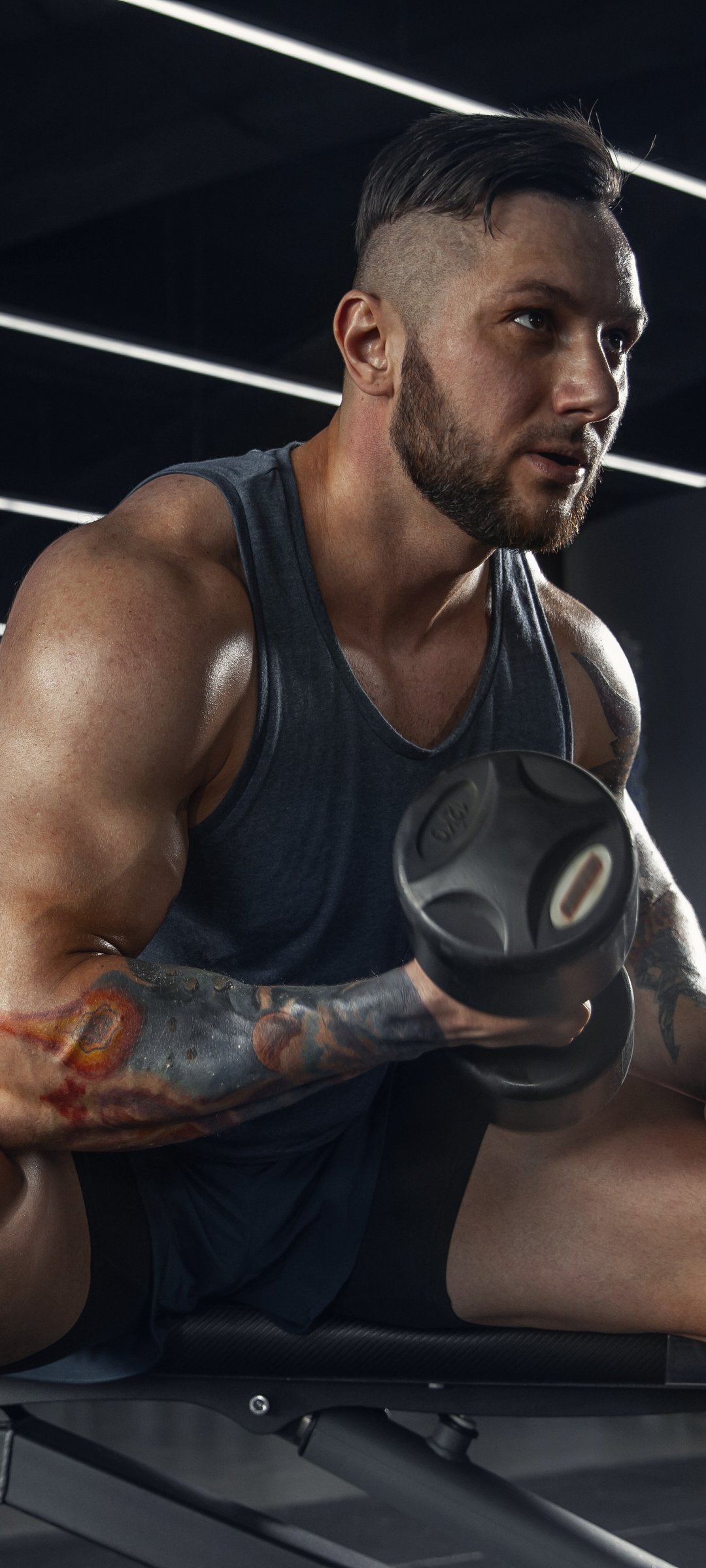 Muscular man with dumbbells - Wallpapers for Samsung Galaxy M55, POCO M4/X4/X5, Xiaomi Redmi 12/13/Note 13/Note 14/Note 14S in 1080x2400 resolution