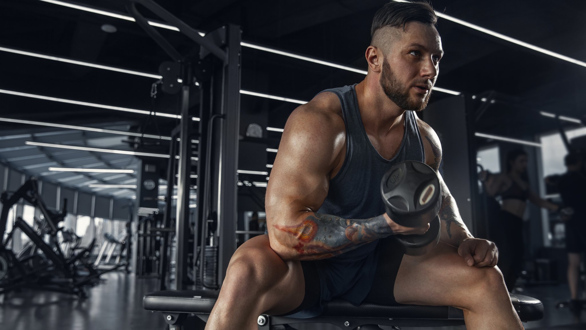 Muscular man with dumbbells - QWXGA wallpapers in 2048x1152 resolution