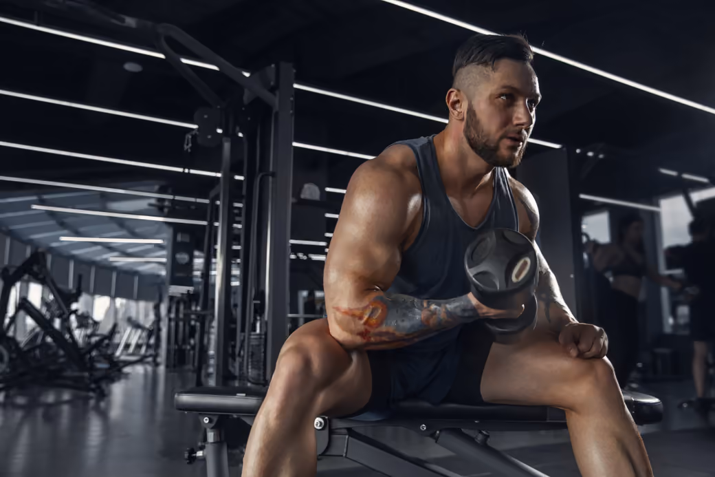 Muscular man with dumbbells — desktop and phone wallpaper, free download
