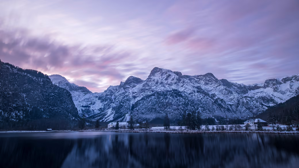 Purple Sunset Over Snowy Mountains — desktop and phone wallpaper, free download