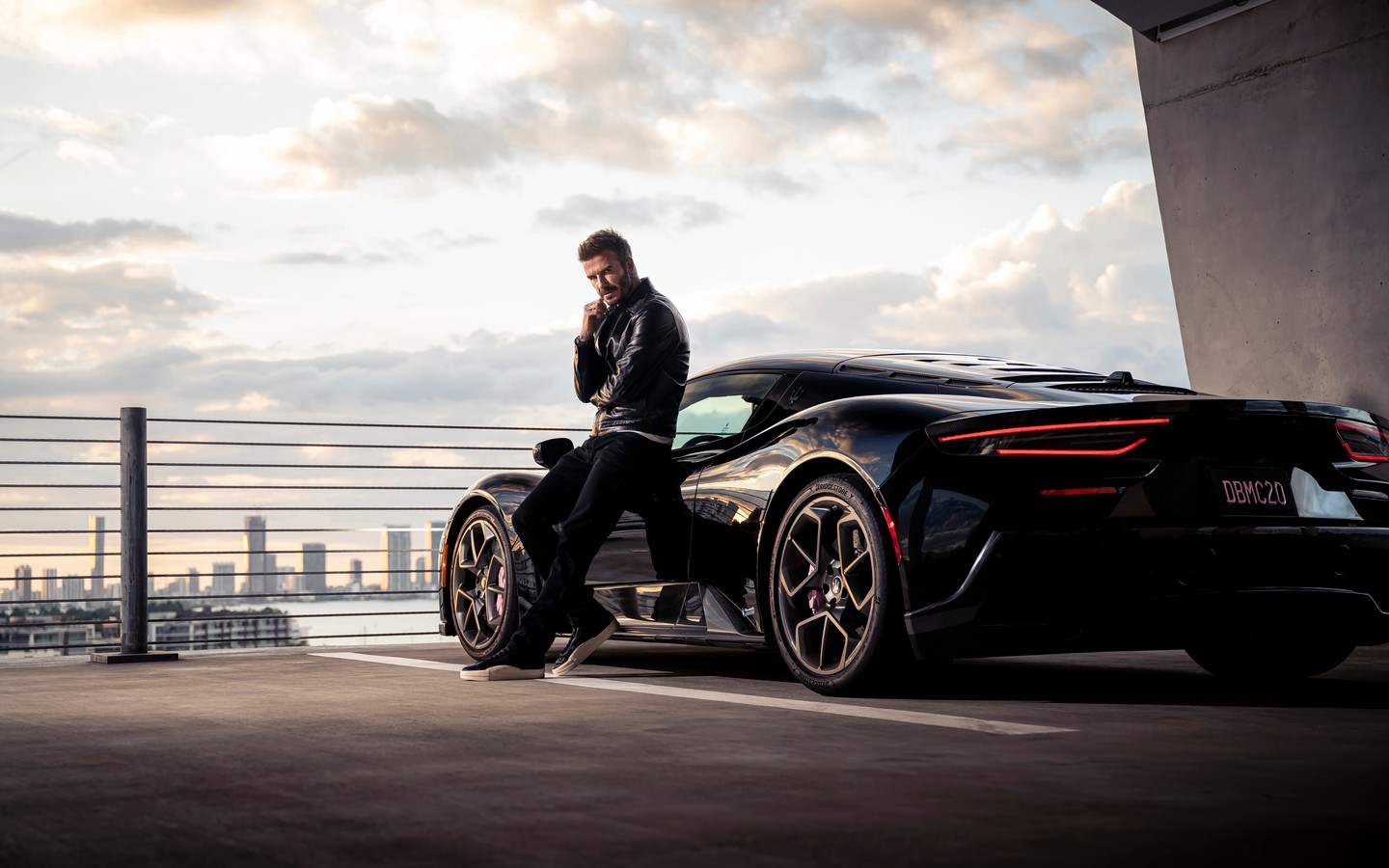 Stylish Car and David Beckham Against Urban Skyline