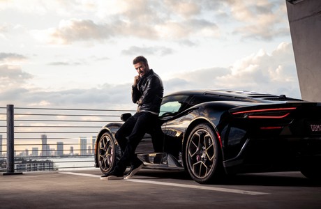 Stylish Car and David Beckham Against Urban Skyline