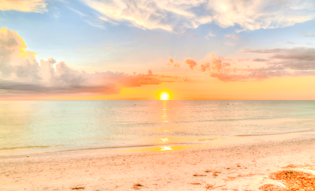 Sunrise Over a Quiet Sea Beach — desktop and phone wallpaper, free download
