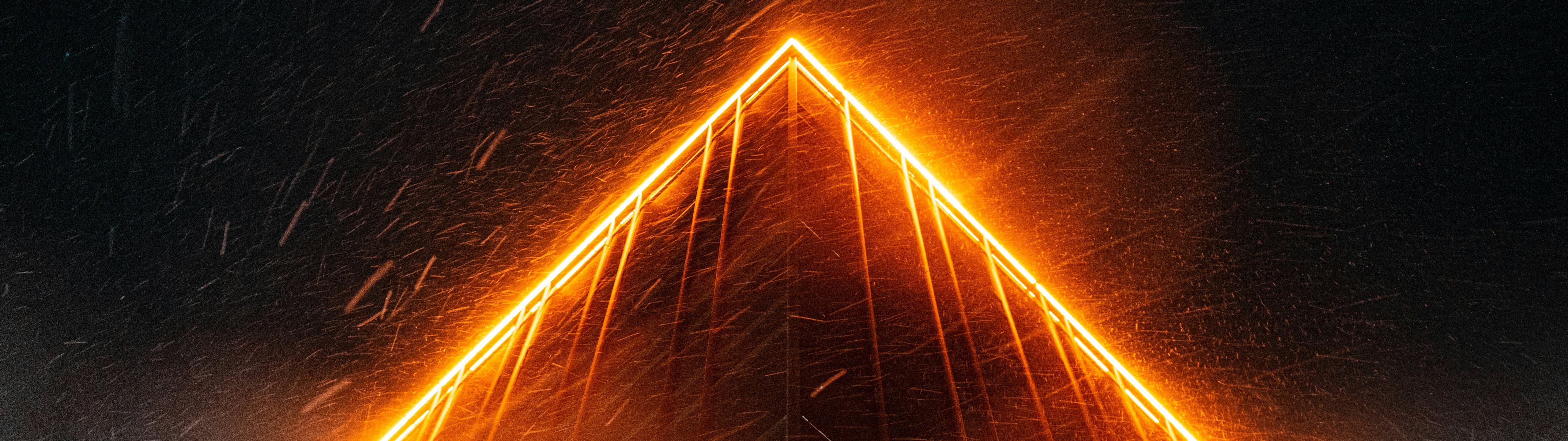 Neon-lit building facade at night - UltraWide 32:9 wallpapers in 5120x1440 resolution
